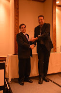 Dr. Don Haddad, Superintendent of St. Vrain Valley Public School District, received the award from USA judge Joel Mills